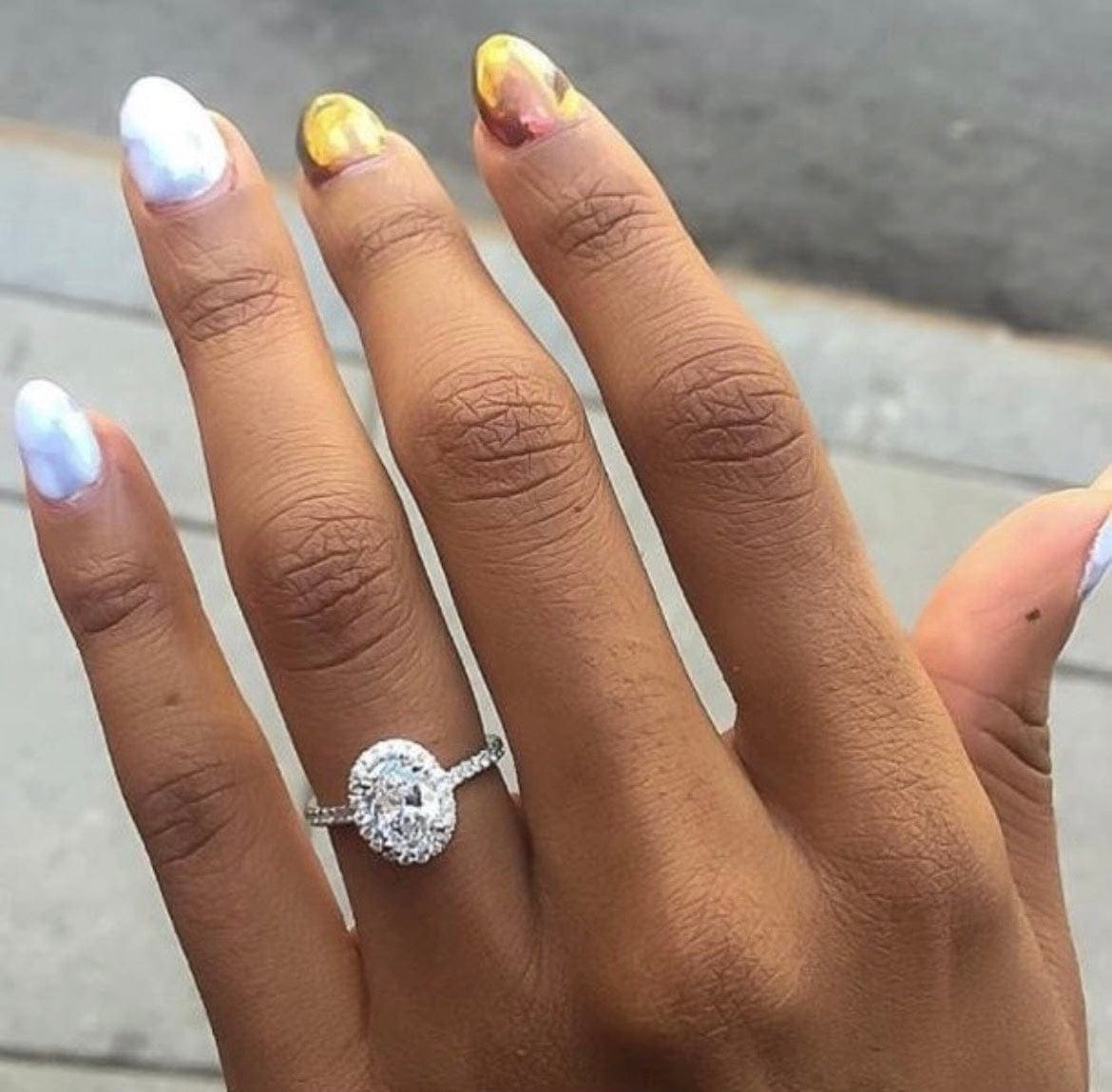 Oval Cut Eagle Claw Halo Engagement Ring